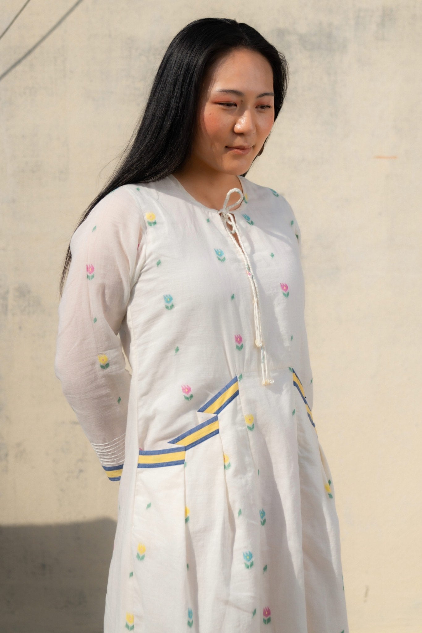 Ankara White Muslin Dress Modest silhouette Jamdani Contrast pleats - Side